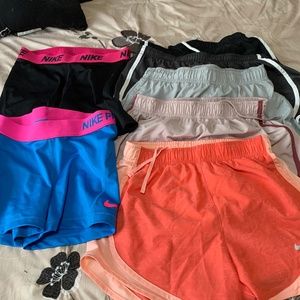 6 pairs of Nike shorts  and 1 Varsity XS size for 1 price